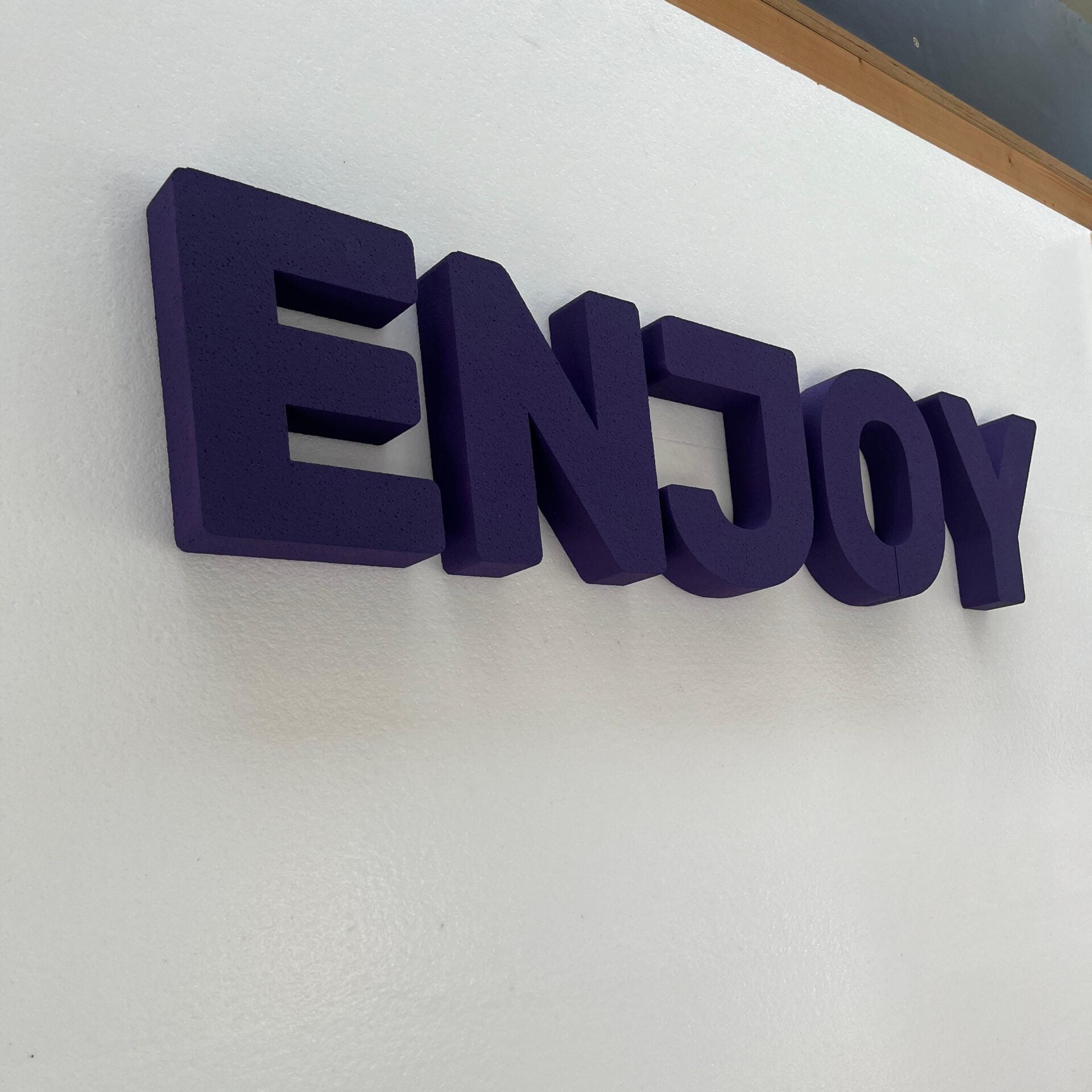 Enjoy letters on wall