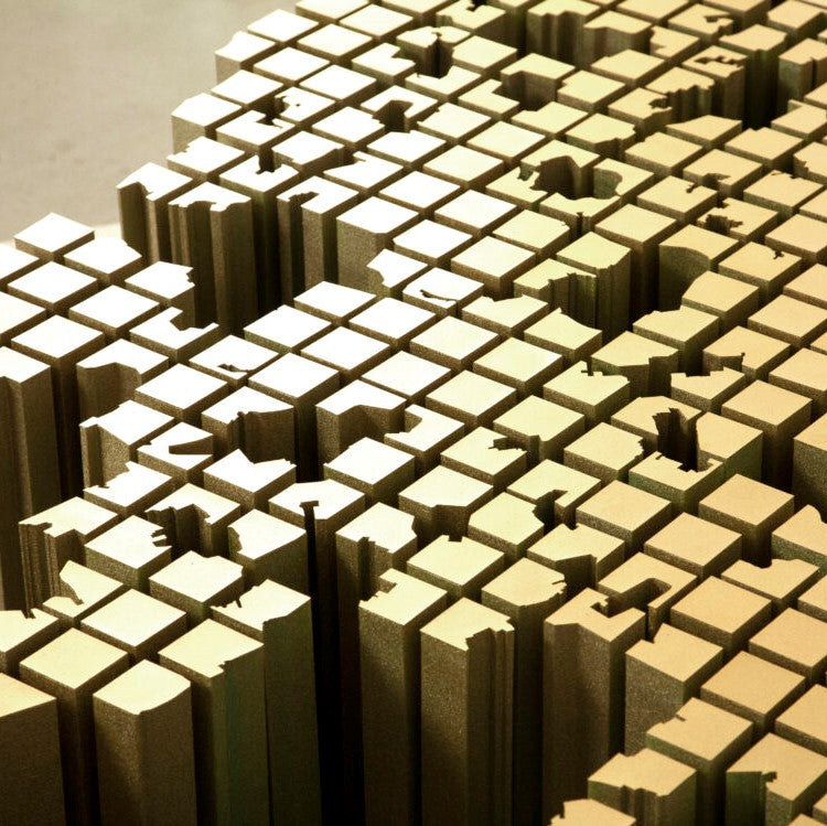 Close-up of a textured gold surface with geometric patterns